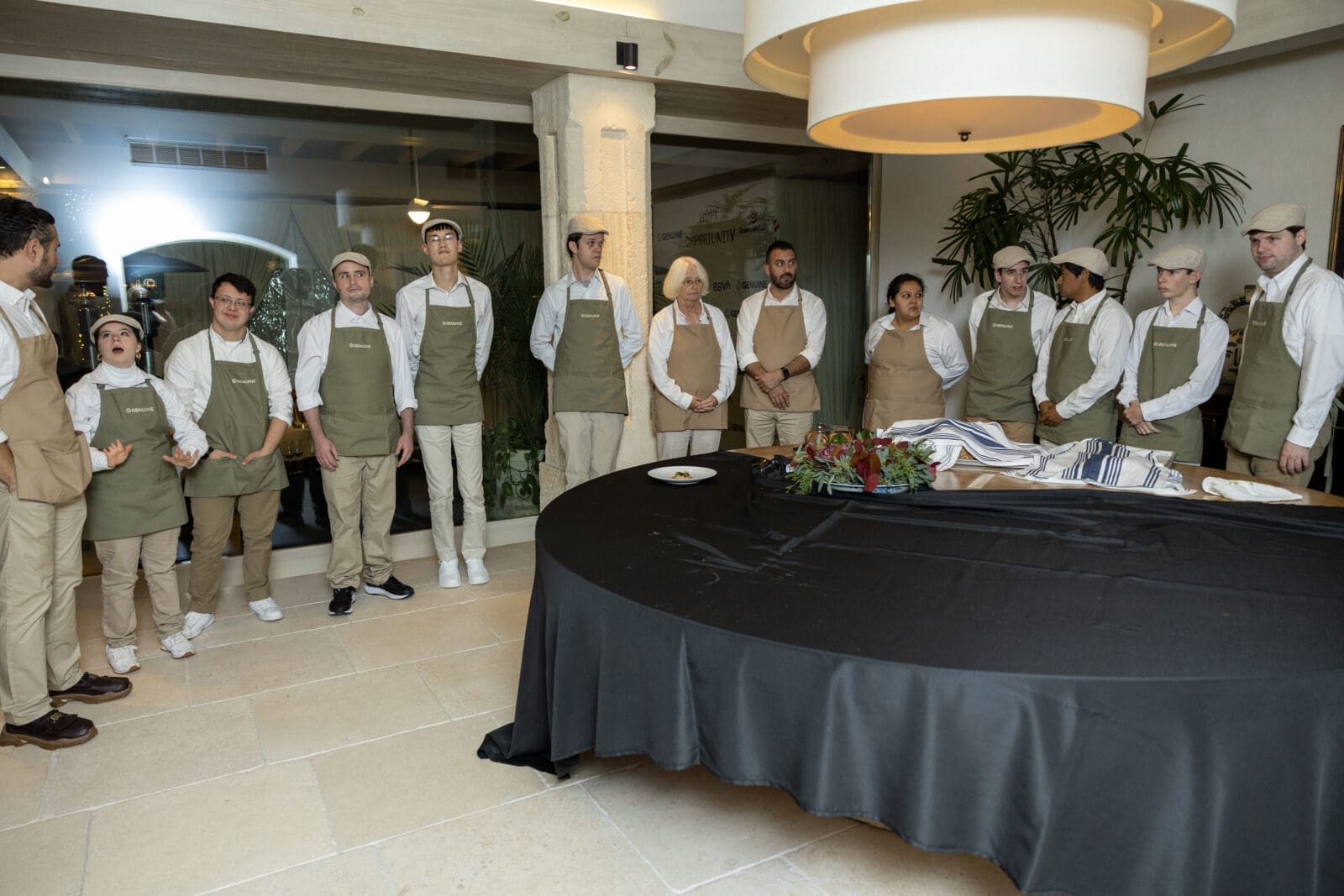 The team of servers from The Genuine Catering Team, a group of neurodiverse individuals who have undergone intensive, real-world training alongside top chefs and hospitality professionals. Their presence is not symbolic—it is central. Throughout the evening, guests will witness a seamless, highly professional service that reflects months of preparation, mentorship, and skill-building, offering a powerful glimpse into what inclusive employment looks like. (Photo by Courtesy of The Genuine Foundation)