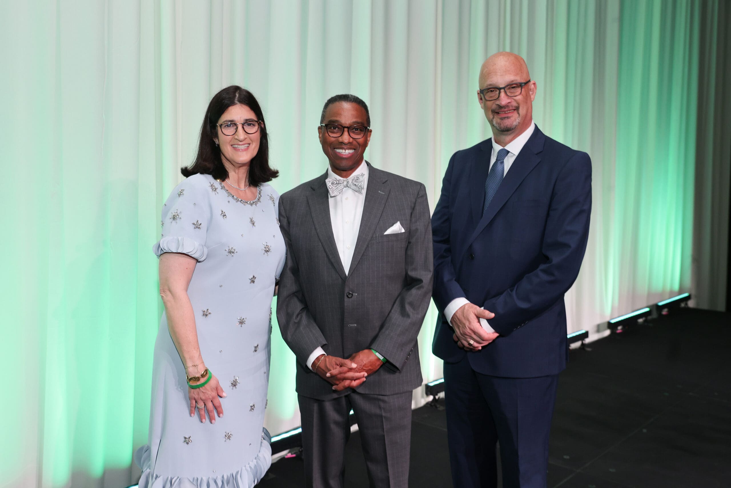 HMH Board Chair Elyse Spector Kalmans, Master of Ceremonies Khambrel Marshall, HMH CEO Gary Weisserman