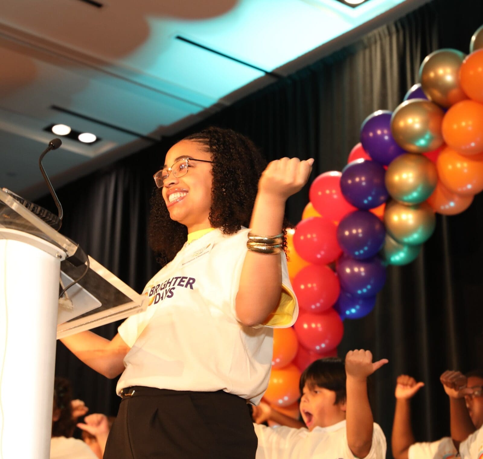 An emotional high point of the afternoon, youth participants from Brighter Days gave a jubilant performance for attendees. (Photo by Thomas Garza and Rob Wythe/Wythe Portrait Studio)