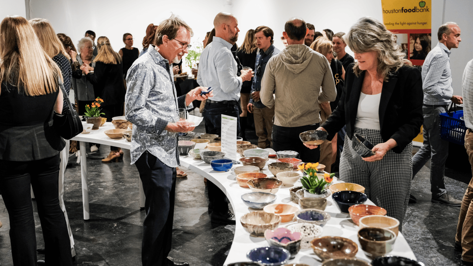 Guests gather beneath the lights of Silver Street Studios during the Empty Bowls Houston Preview Party. (Photo courtesy Empty Bowls Houston)
