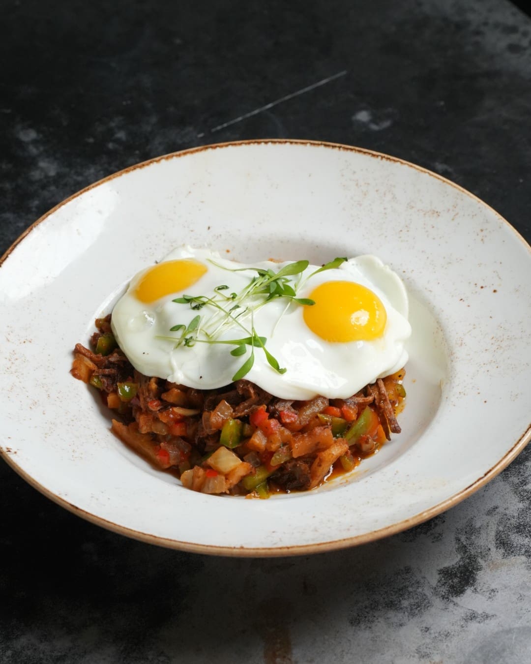 Weekend brunch at State Fare includes everything from Birria Benedict and chicken fried steak and eggs to sweet griddlecakes. (Photo courtesy State Fare)