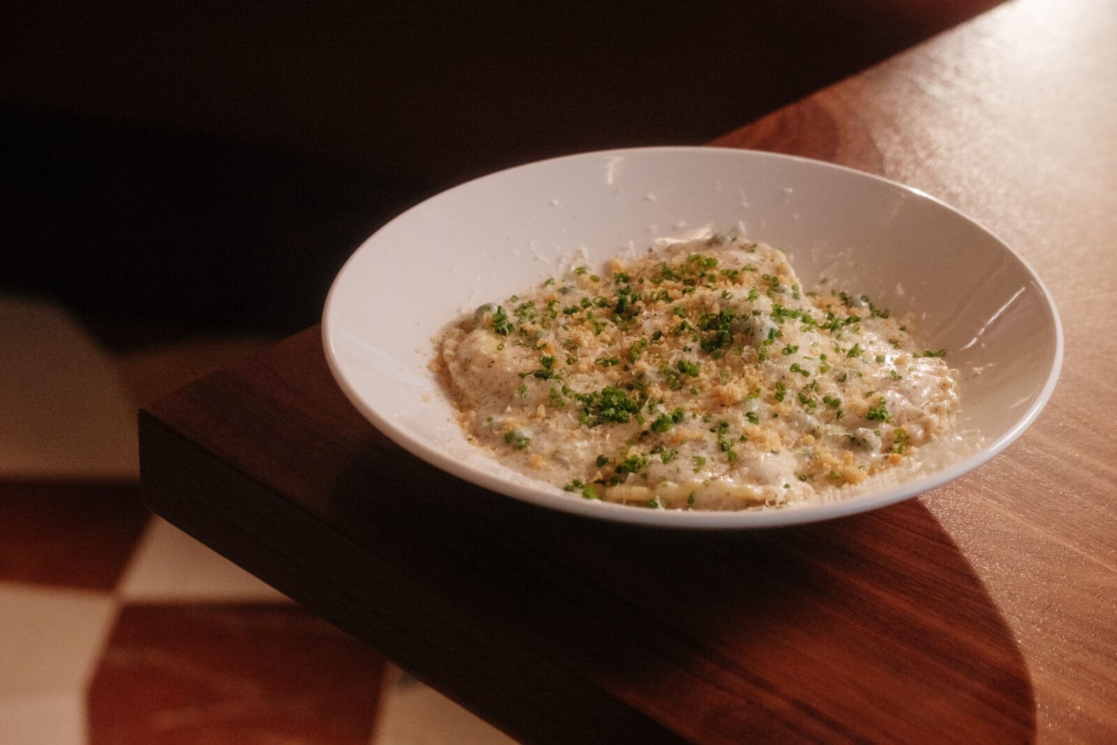 Pasta made in-house at Kirkwood includes the truffle-scented ravioli stuffed with four cheeses, enrobed with a parmesan cream sauce. (Photo by Quit Nguyen )