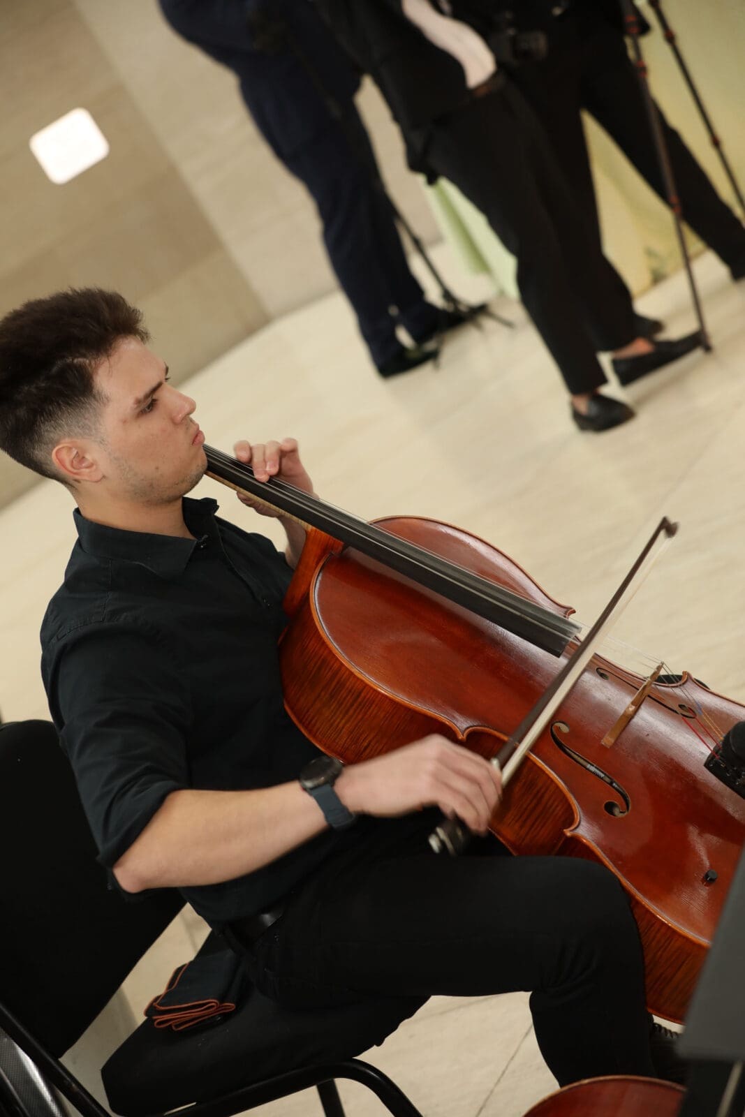 A cellist from Dallas Symphony Orchestra's Young Strings (Photos by Thomas Garza, David Truong, and Rob Wythe/Wythe Portrait Studio)