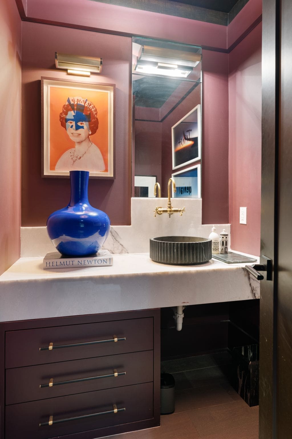 The high notes of interior design are carried over into the powder room/half bath. (Photo by Aria Media)