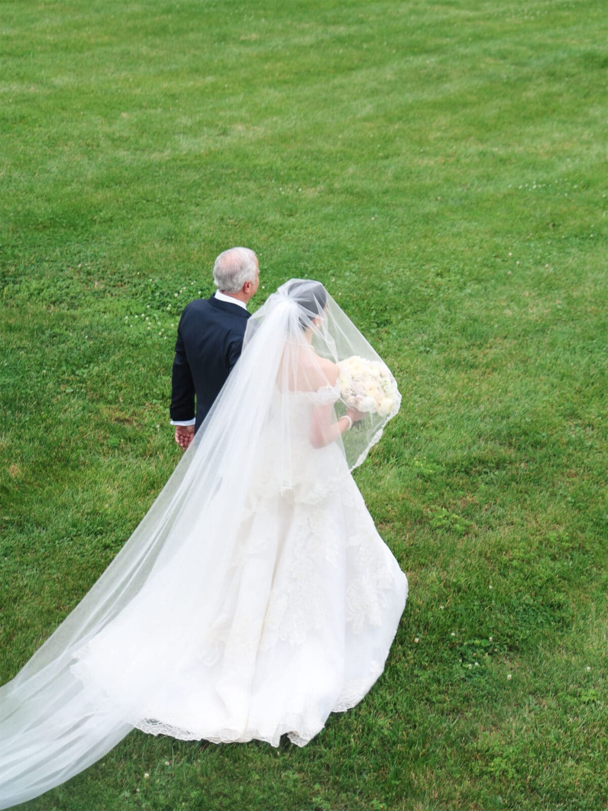 The bride's father walks her down the aisle (Photo by The Browns)