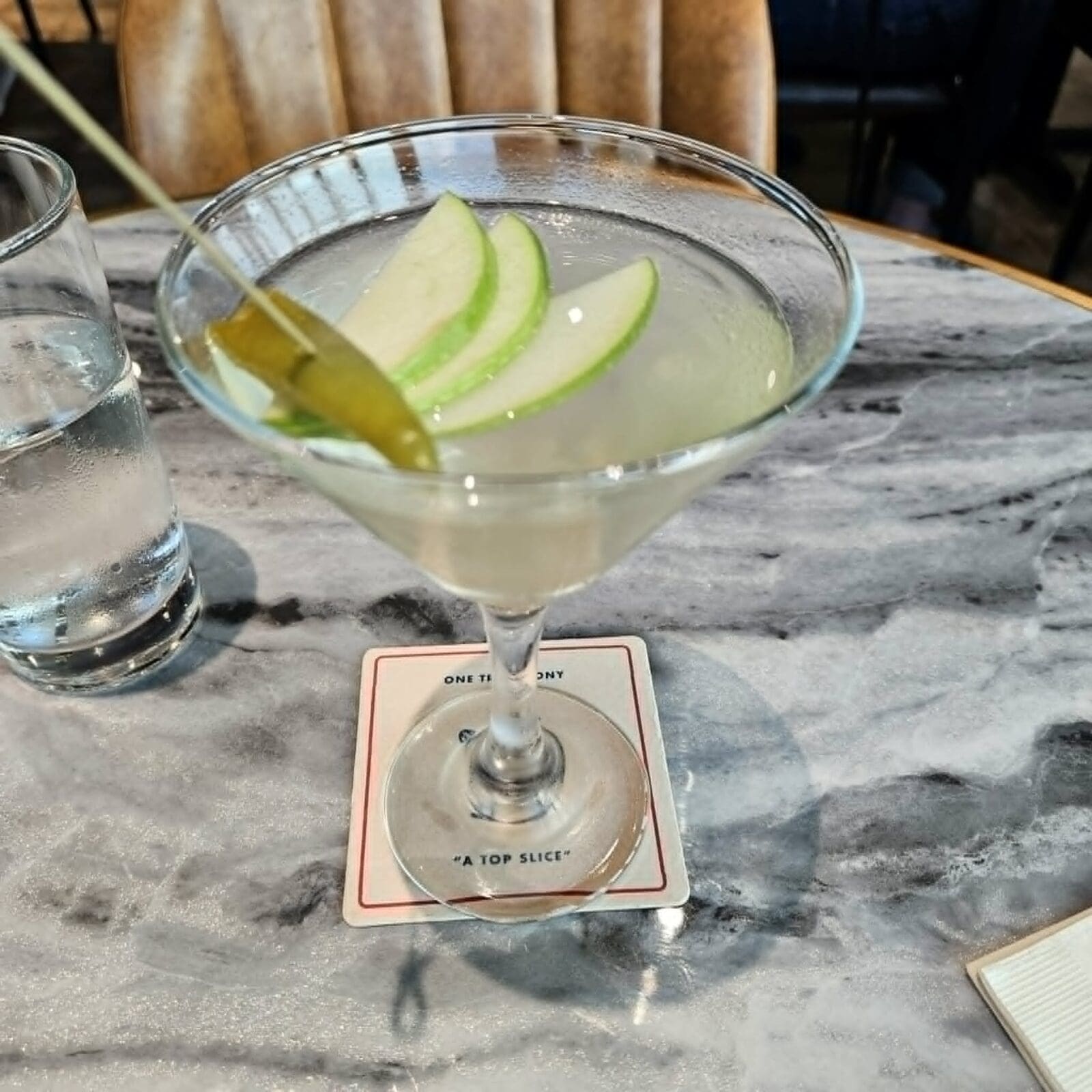 The Pepperoncini Tini, a rum-based martini made with premium Italian white vermouth and topped with a pepperoncino and slices of Granny Smith apple, is a delightful cocktail served at One Trick Pony Pizza Tavern. (Courtesy)