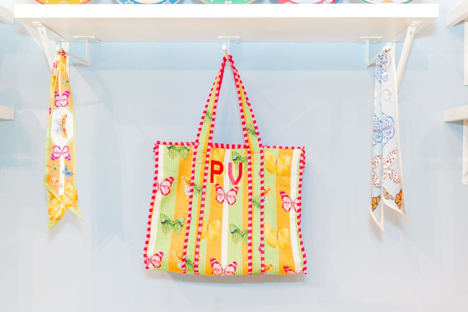 Pillows, scarves, acrylic artwork, stationery, and home décor showcase the breadth of Cartie's colorful product line, which has grown from a greeting card side project into a multistate brand. (Photo by Canon Sawyer)