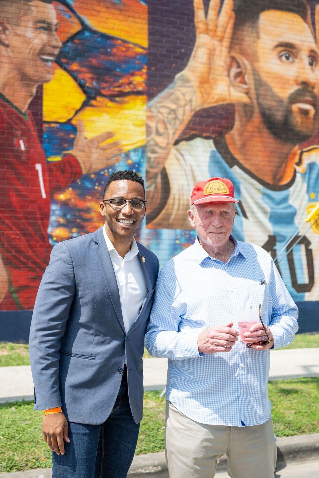 Rep. Christian Menefee (Left) attends the unveiling of José "Meenr" Arredondo's "Welcome Mural," 2026, at the Original Ninfa's on Navigation. (Photo by Shane Dante. Courtesy Rachel Austin PR)