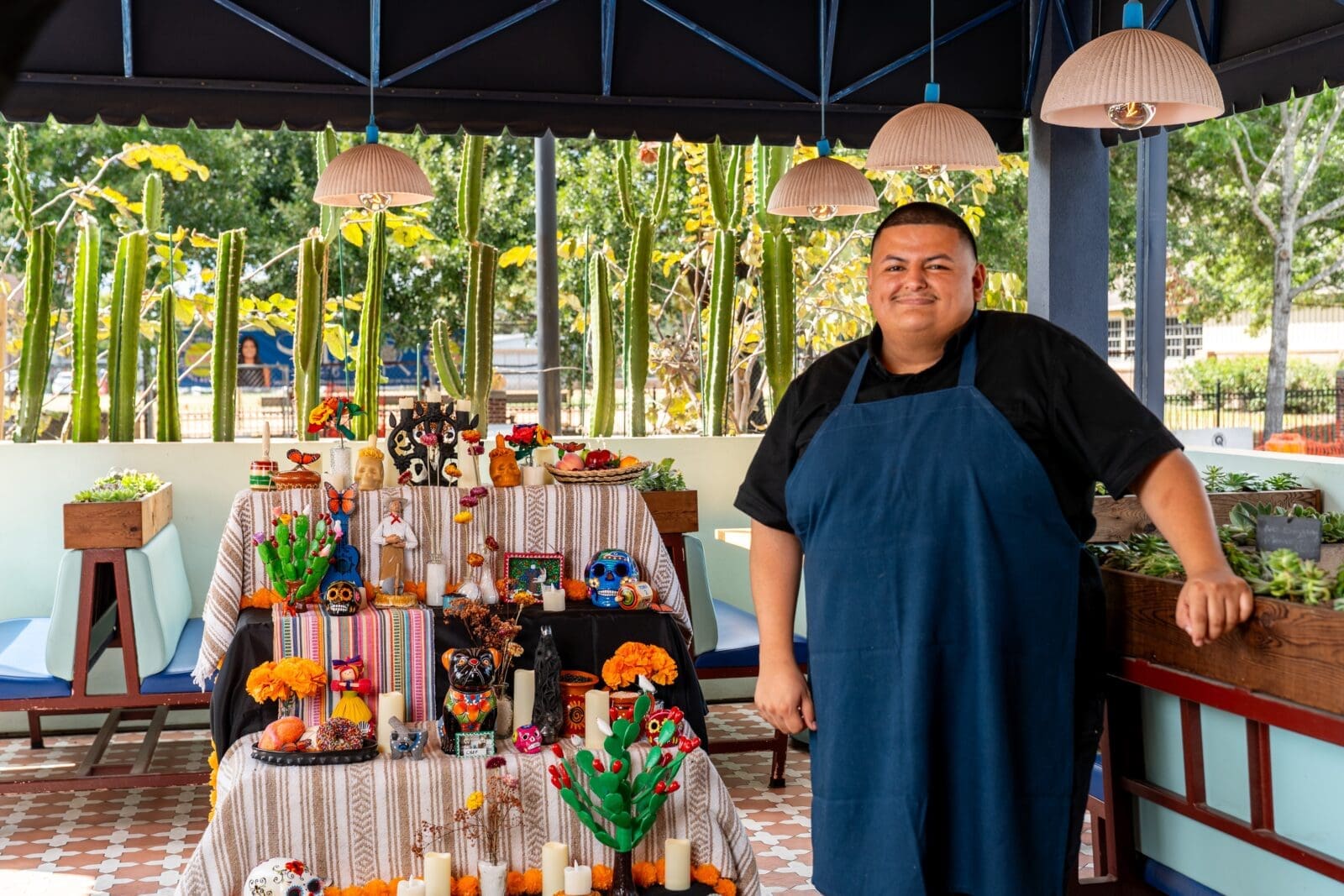 Chef Adrian Torres outside on the adjoining enclosed patio during Dia de Muertos festivities at Maximo. (Photo by Carla Gomez)