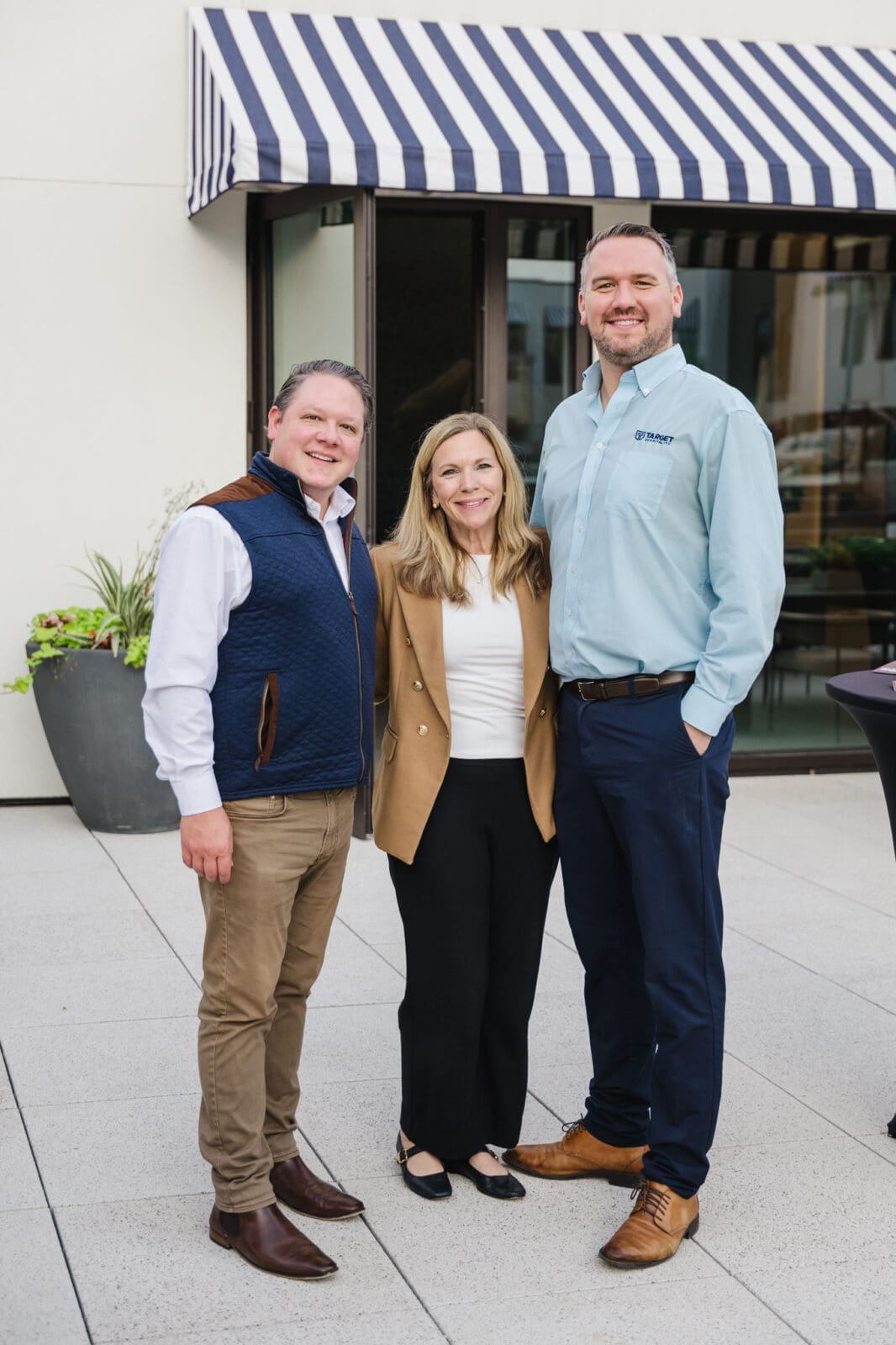 Evan Berlin, Ann Wolford, Jeffery Skrabanek on the pool deck at 1 Riva Row. (Photo by Johnny Than)