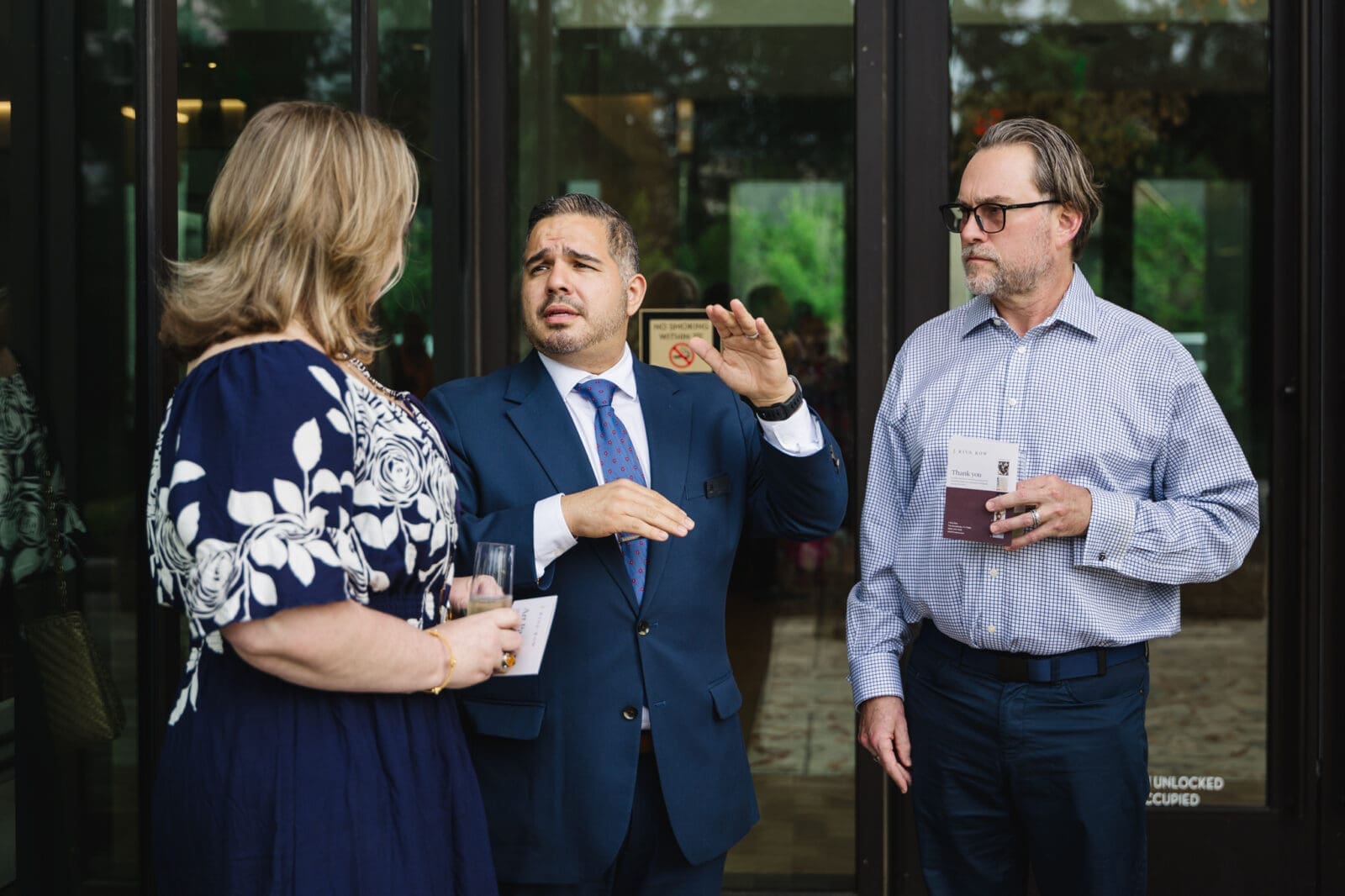Stefanie and Jayson Ecuyer listen as Sergio discusses the features of 1 Riva Row. (Photo by Johnny Than)