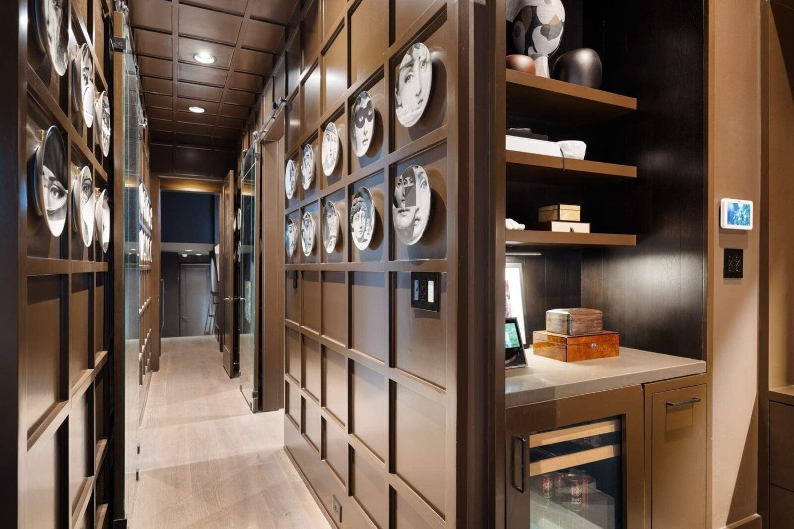 The refined millwork (and coffee bar) set the sophisticated tone of the primary suite at 2117 Elmen Street. (Photo by Aria Media)