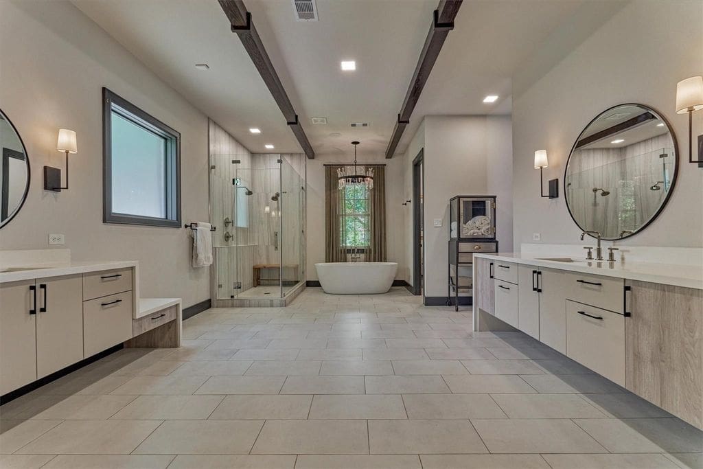The primary bath at 64 Autumn Crest is open and bright.