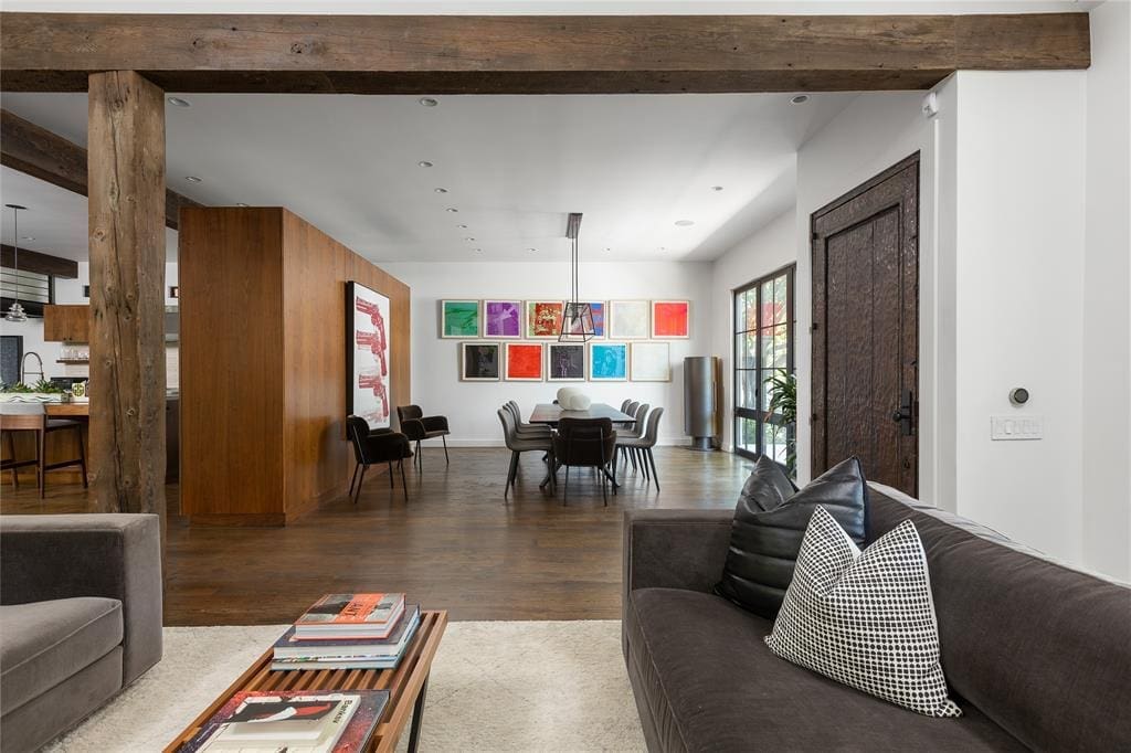 The designer selected high-end finishes throughout and utilized natural materials like stone and reclaimed wood to provide warmth and texture to the sleek space. (Photo by Compass RE Texas, LLC)