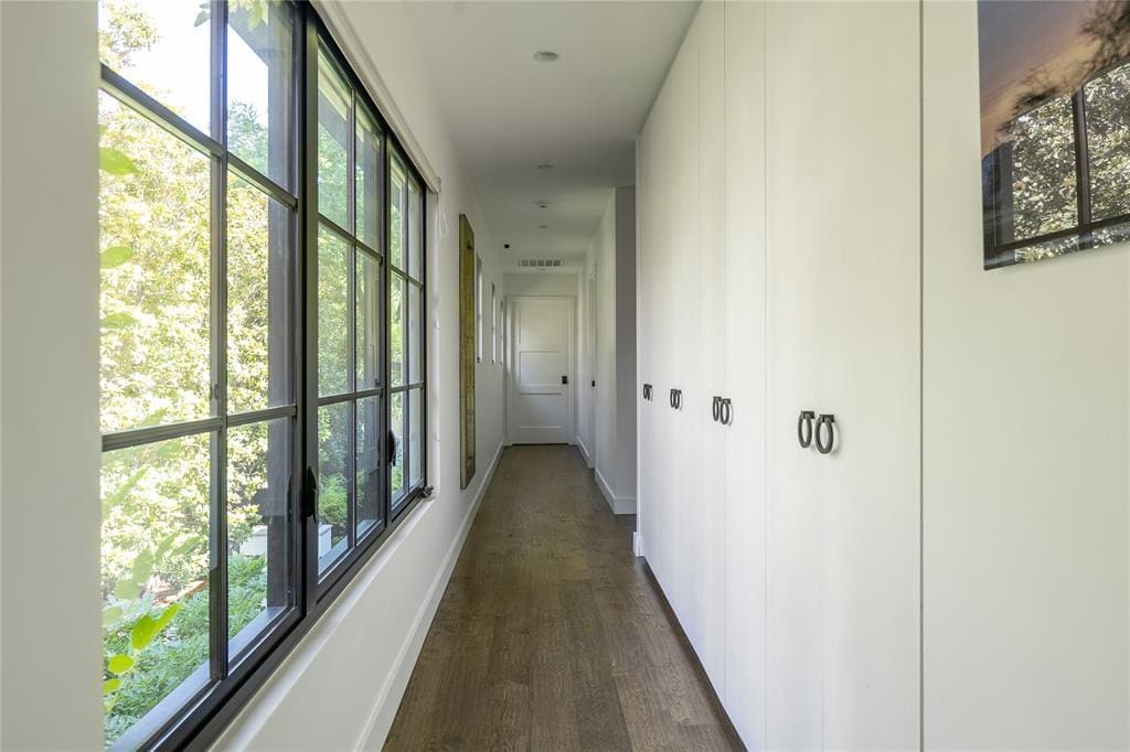 Large windows flood the space with natural light. (Photo by Compass RE Texas, LLC)