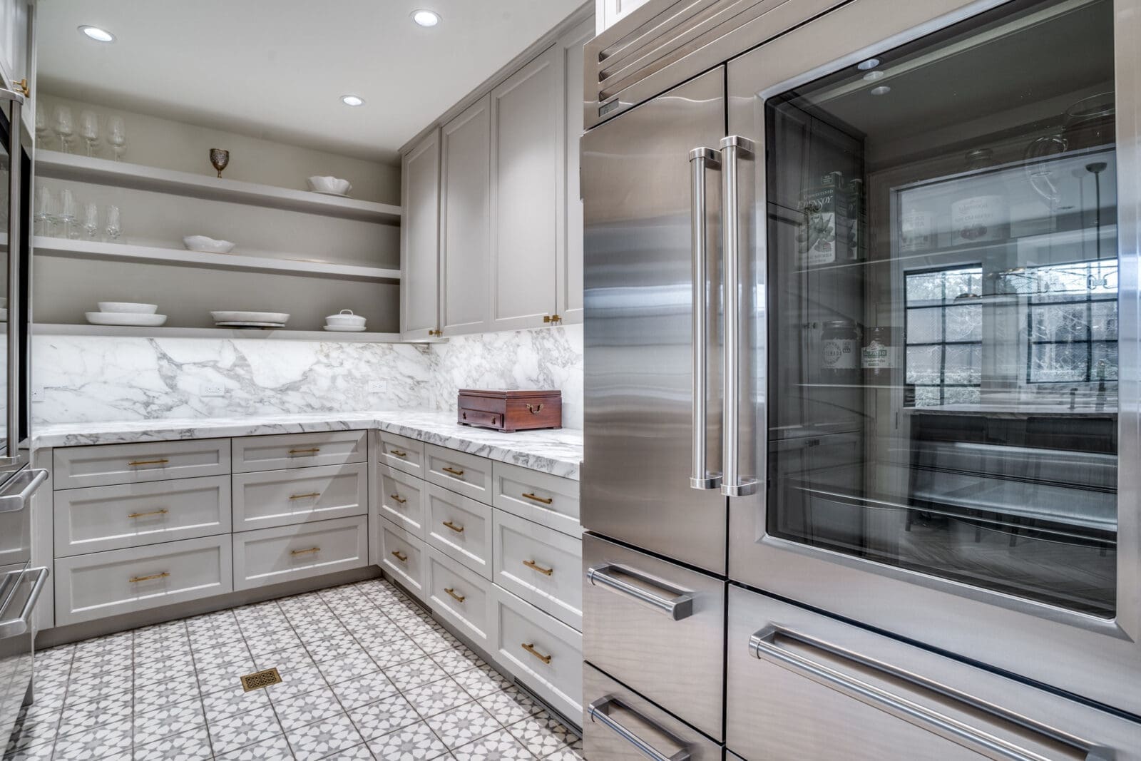 Fittingly, 3606 Saint Johns Drive provides a service kitchen that houses the SubZero refrigerator and freezer, as well as the wine cooler. (Photo by Allie Beth Allman & Associates)