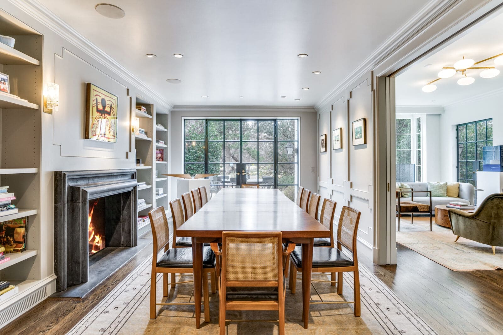 This home includes five fireplaces. The best one, though, is in the dining room, which offers seating for 12 and is surrounded by bookshelves. (Photo by Allie Beth Allman & Associates)