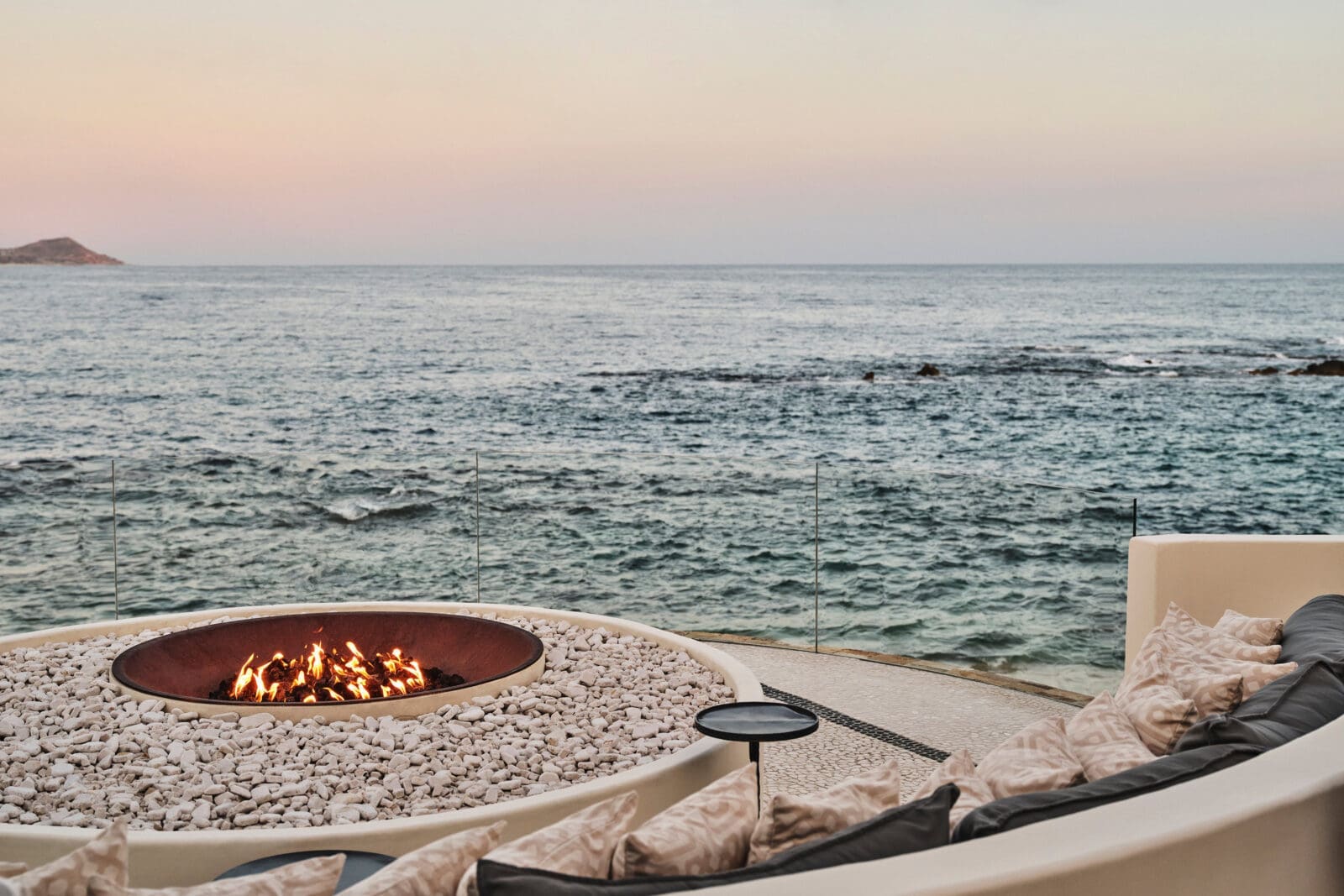 COMAL, the oceanfront restaurant, glows at golden hour. (Photo by Chileno Bay Resort & Residences, Auberge Collection)