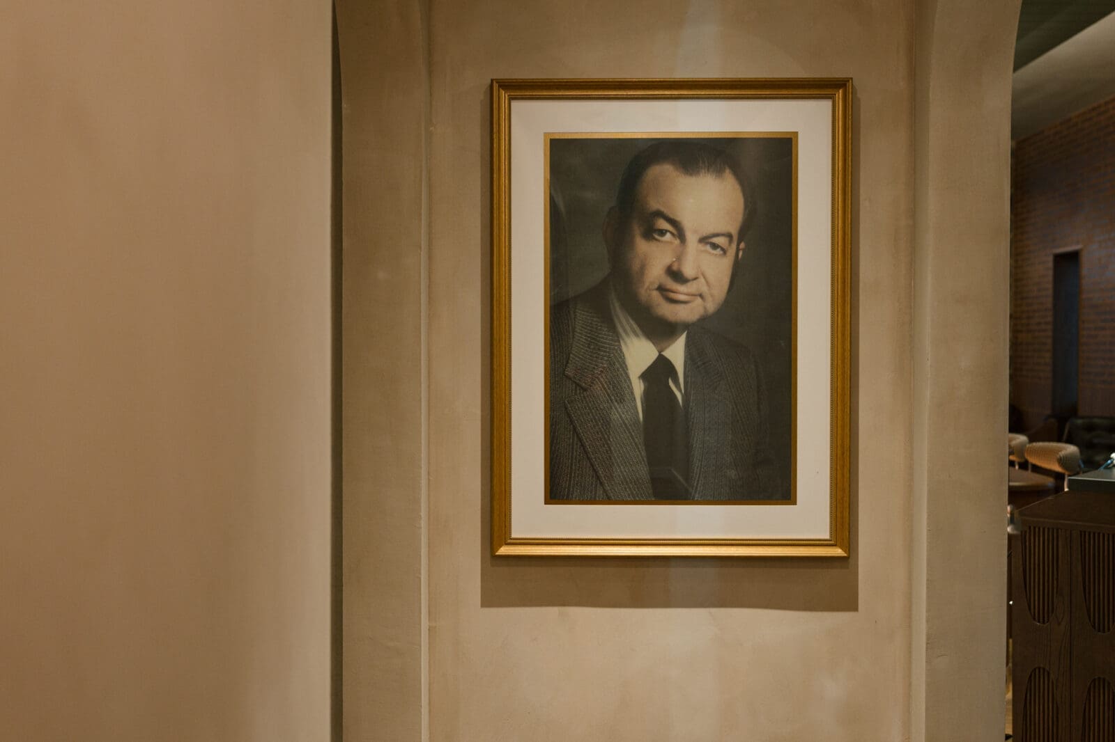 A portrait honoring the original Caravan Motor Hotel's legacy is displayed inside Caravan Court Hotel. (Courtesy)