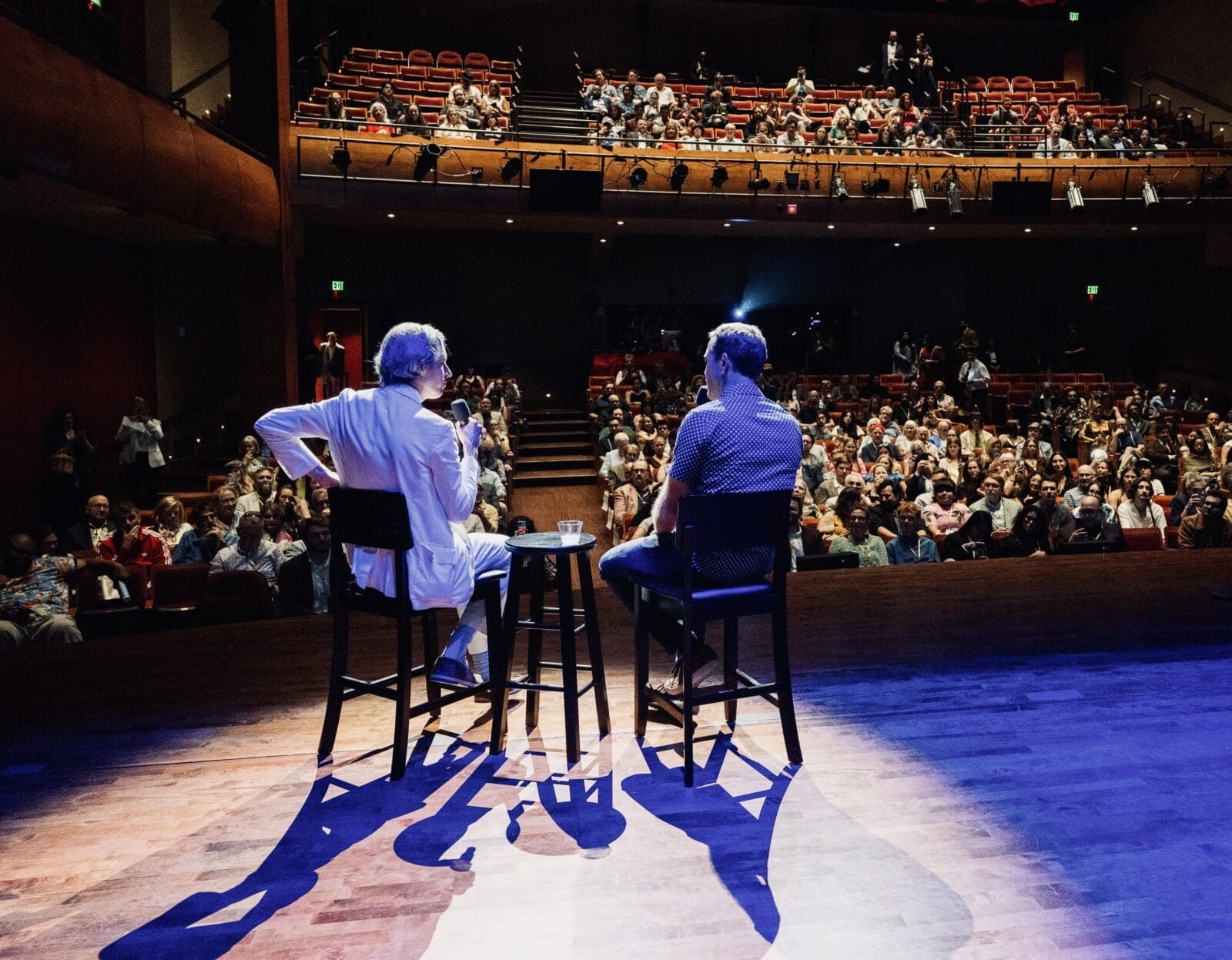 On the stage of Hobby Center's Zilkha Hall, Wes Anderson in conversation with moderator and friend MIke Maggart during the Homecoming Soirée to save Garden Oaks Theater. The sold-out fundraiser marked one of the largest public gatherings yet in the effort to save Garden Oaks Theater. (Photo by Alan Nguyen)