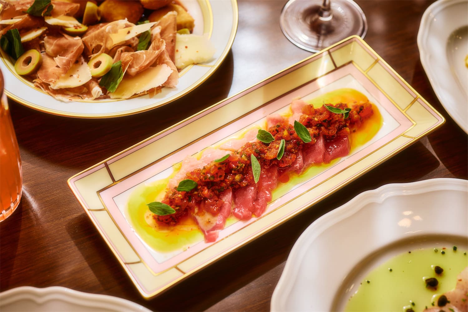The Toro Crudo with tomato tartare, yuzu vinaigrette, and oregano is a great starter at Scilla. (Photo by Chase Hall)