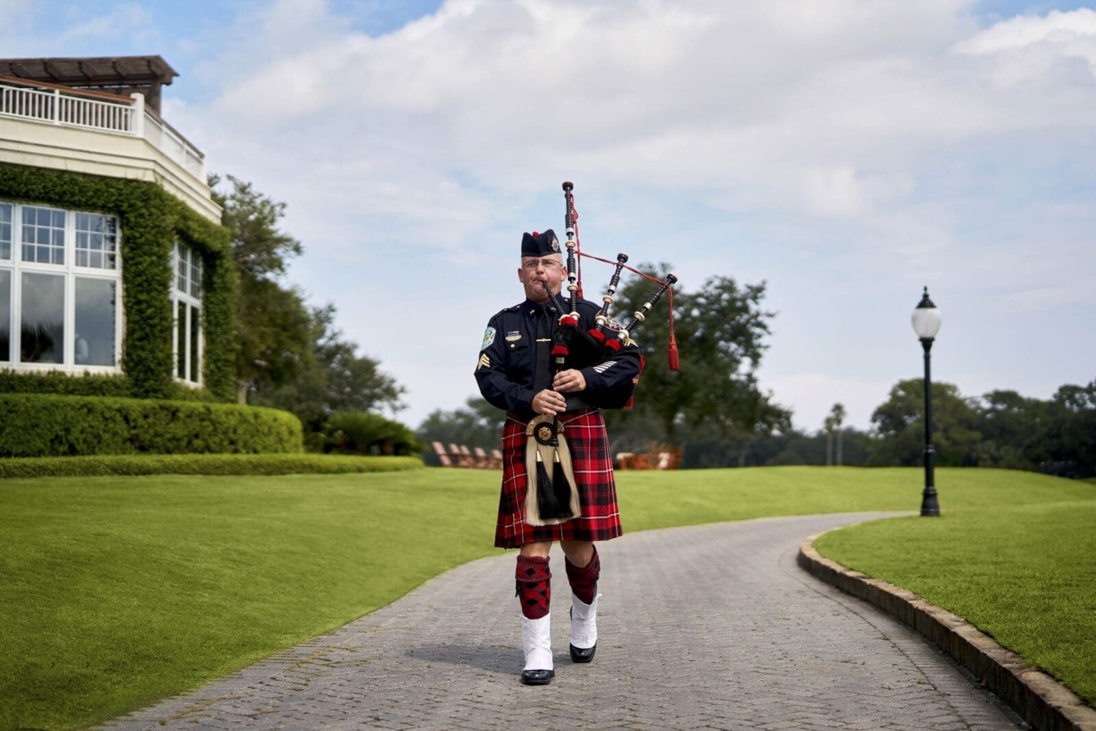 Offered year-round on the terrace of The Lodge, diners and guests enjoy a traditional Scottish bagpiper sunset serenade that formally marks the end of each day at the Sea Island Golf Club. (Photo by Sea Island)