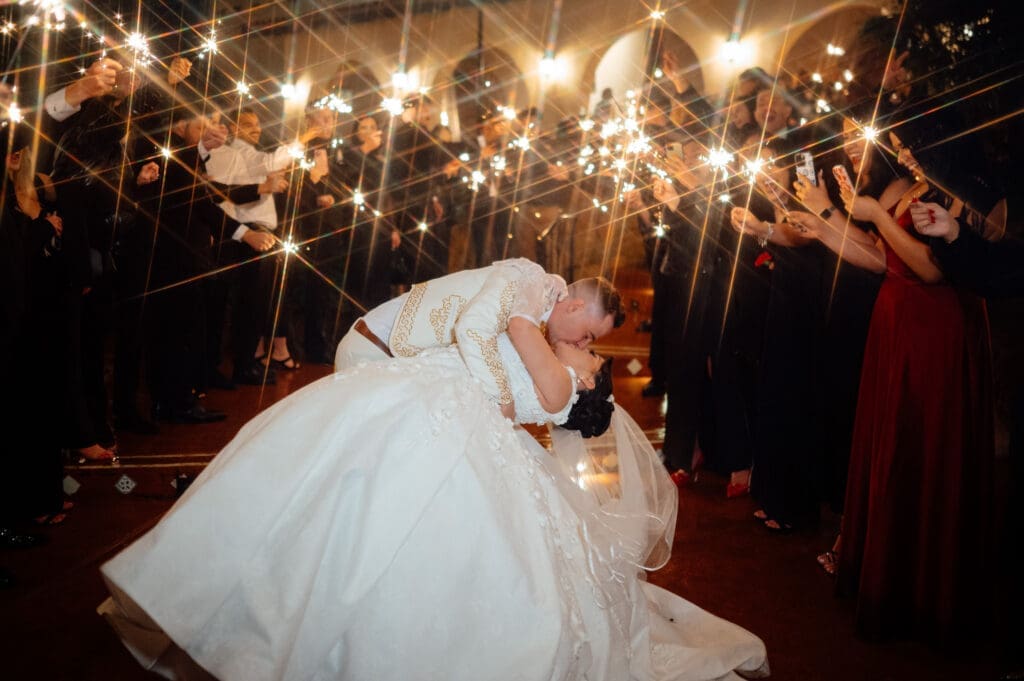 Guests made good use of the sparklers, and raindrops just added to the beauty of this wedding night. (Photo by JMG Photography Houston)